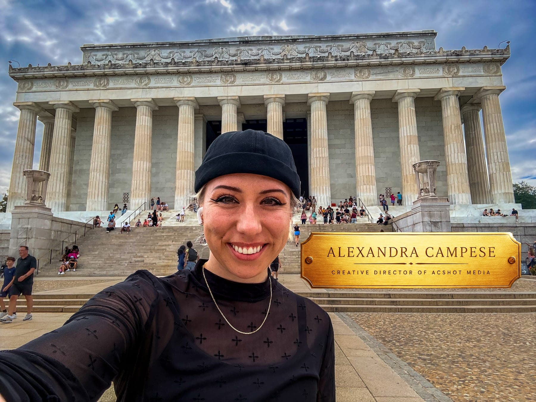 Alexandra Campese, Creative Director of ACSHOT MEDIA, smiling in front of the Lincoln Memorial in Washington, DC